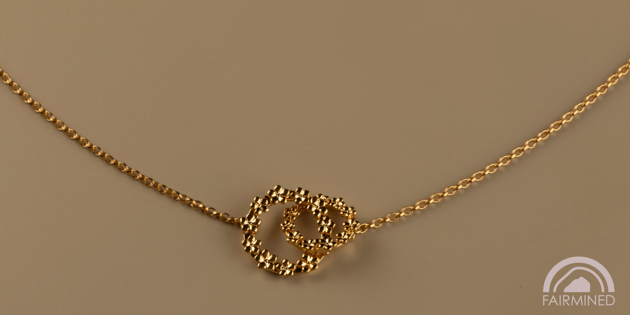 The Forget-Me-Not 'Love Link Wreath' Silver Necklace layered in Fairmined Gold