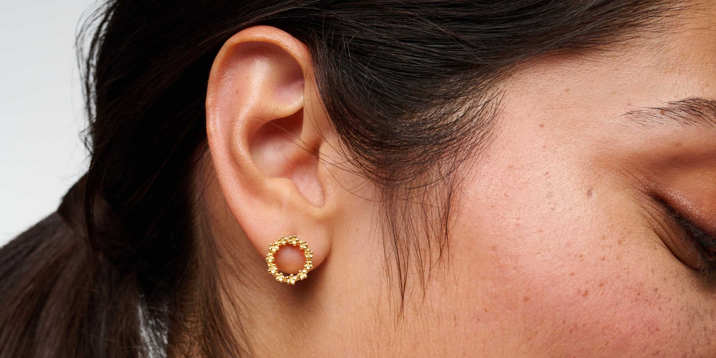 The Forget-Me-Not 'Wreath' Silver Stud Earrings layered in Fairmined Gold
